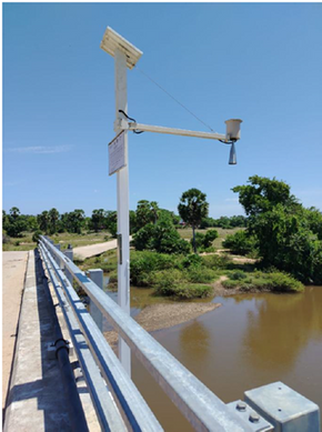 Rain gauge installation on a bridge